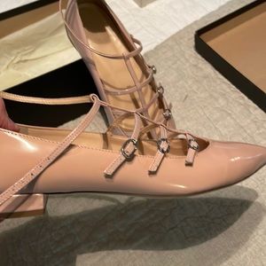 Caged flats in glossy leather